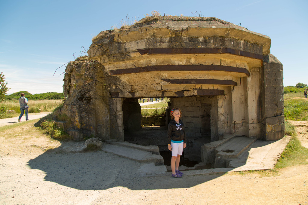 Sydney at a gun emplacement at Pointe du Hoc.