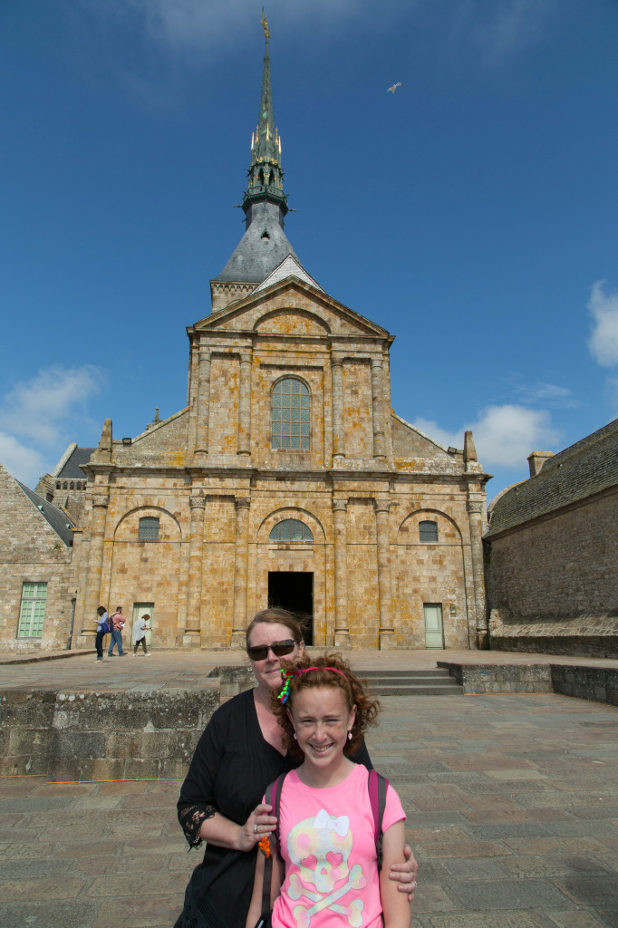 Kim and Syd outside the church at Mont Saint-Michel. Top of the rock, ma!