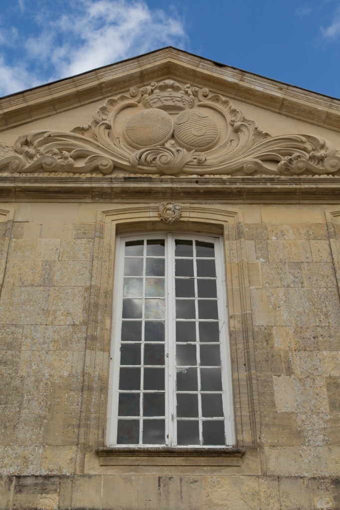 The family coat of arms over the chateau.